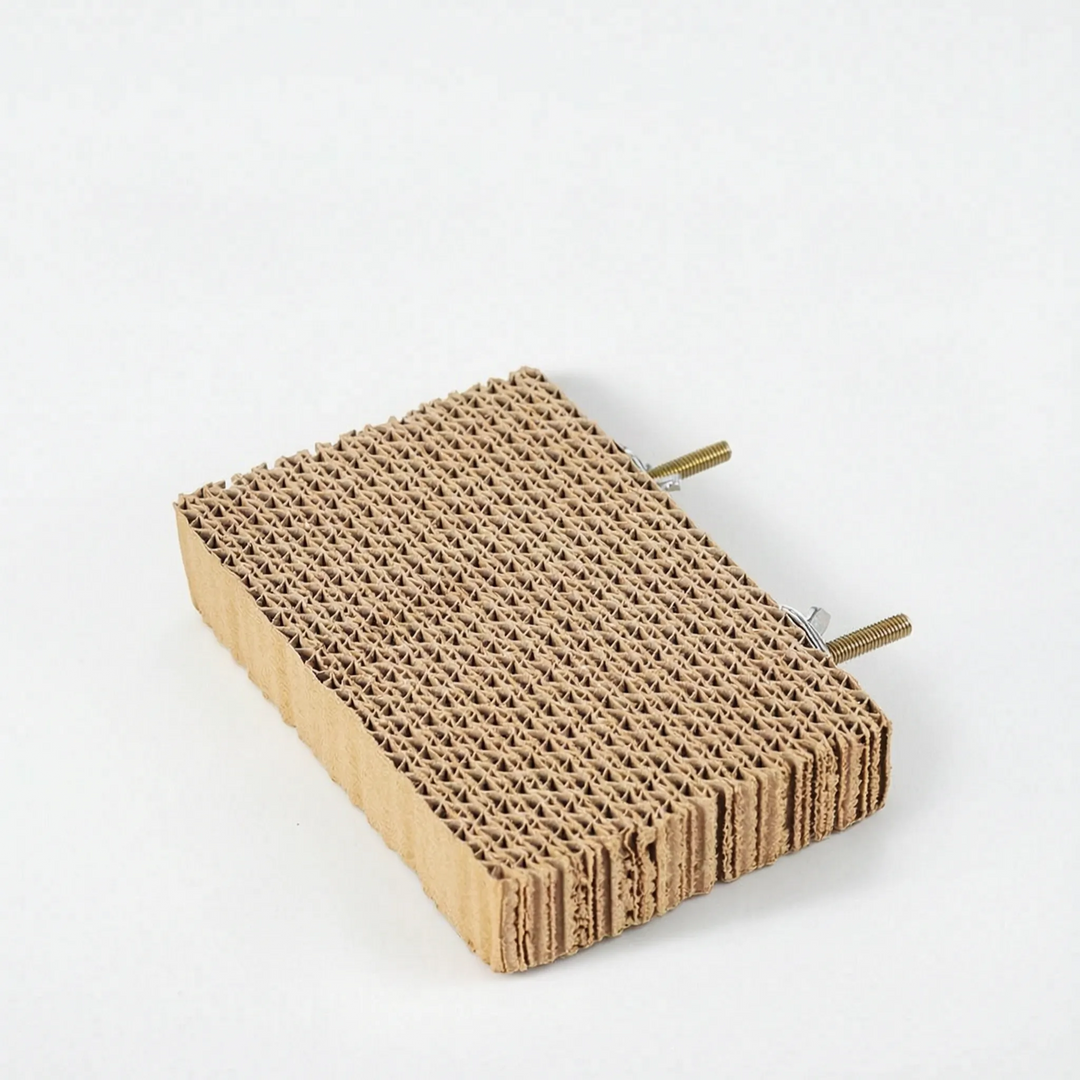 Smaller rectangular cardboard platform without corks, with two threaded bolts and fixings sticking out from the back edge. 7