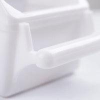 Close-up of the feeder's smooth rounded perch bar and its support arm, in white plastic. 4