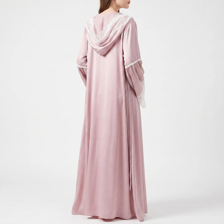 Back view of the pink satin robe on a model, showing the lace-trimmed hood and flared sleeves. 2