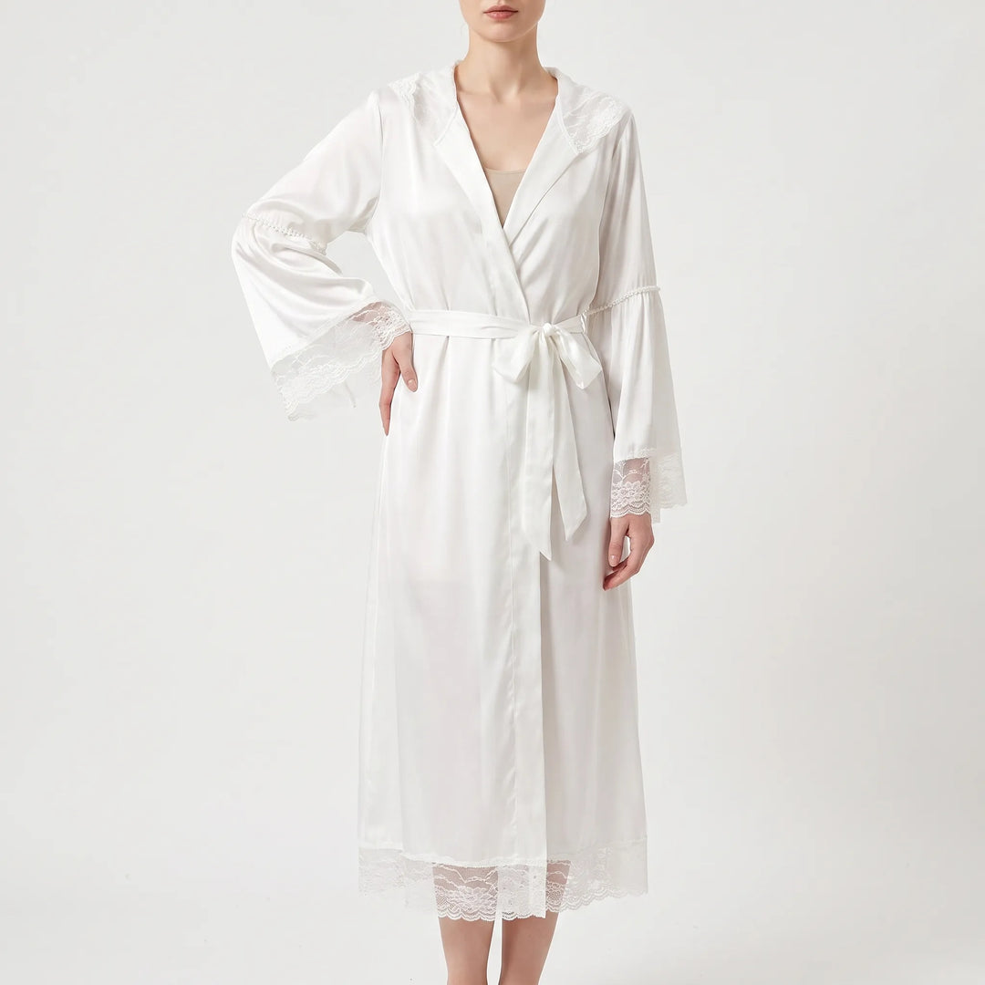 Model wears the white satin version of the robe, belted at the waist, with lace sleeve cuffs and hem. 5