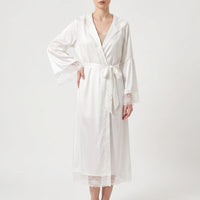 Model wears the white satin version of the robe, belted at the waist, with lace sleeve cuffs and hem. 5