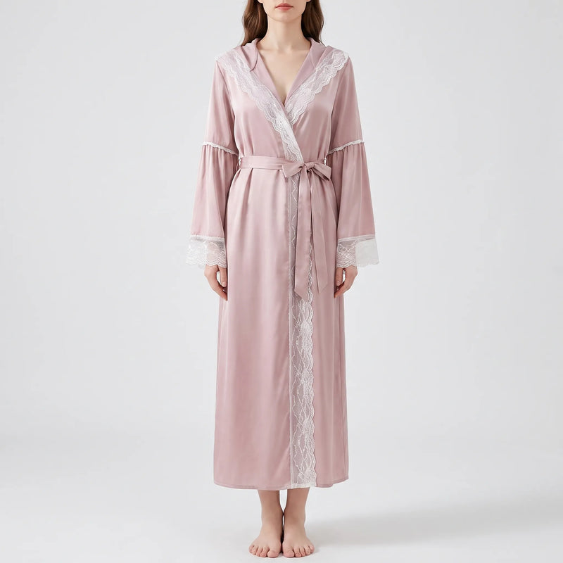 Front view of a model in the pink satin robe tied with a bow, lace running down the front opening. 6