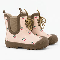 Pair of lace-up rubber boots in soft pink with a red cherry print, tan trim, elastic side panel and lugged sole. 7