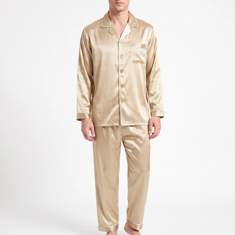 Front view of a model wearing the pyjama set in a light gold satin with cream piping and matching buttons. 8