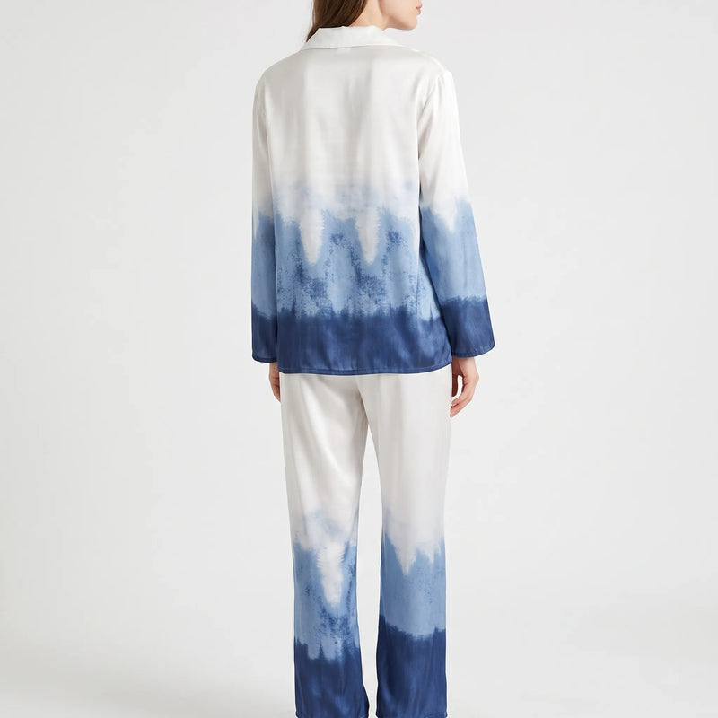 Back view of the model wearing the ombre pyjama set, showing the white-to-navy gradient across the shirt and wide-leg trousers. 3