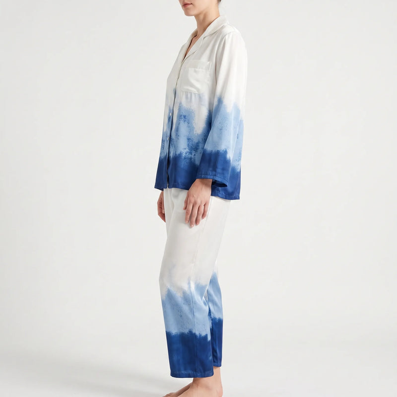 Side view of the model in the ombre pyjama set, showing the long sleeves, buttoned front and gradient from white to deep blue. 4