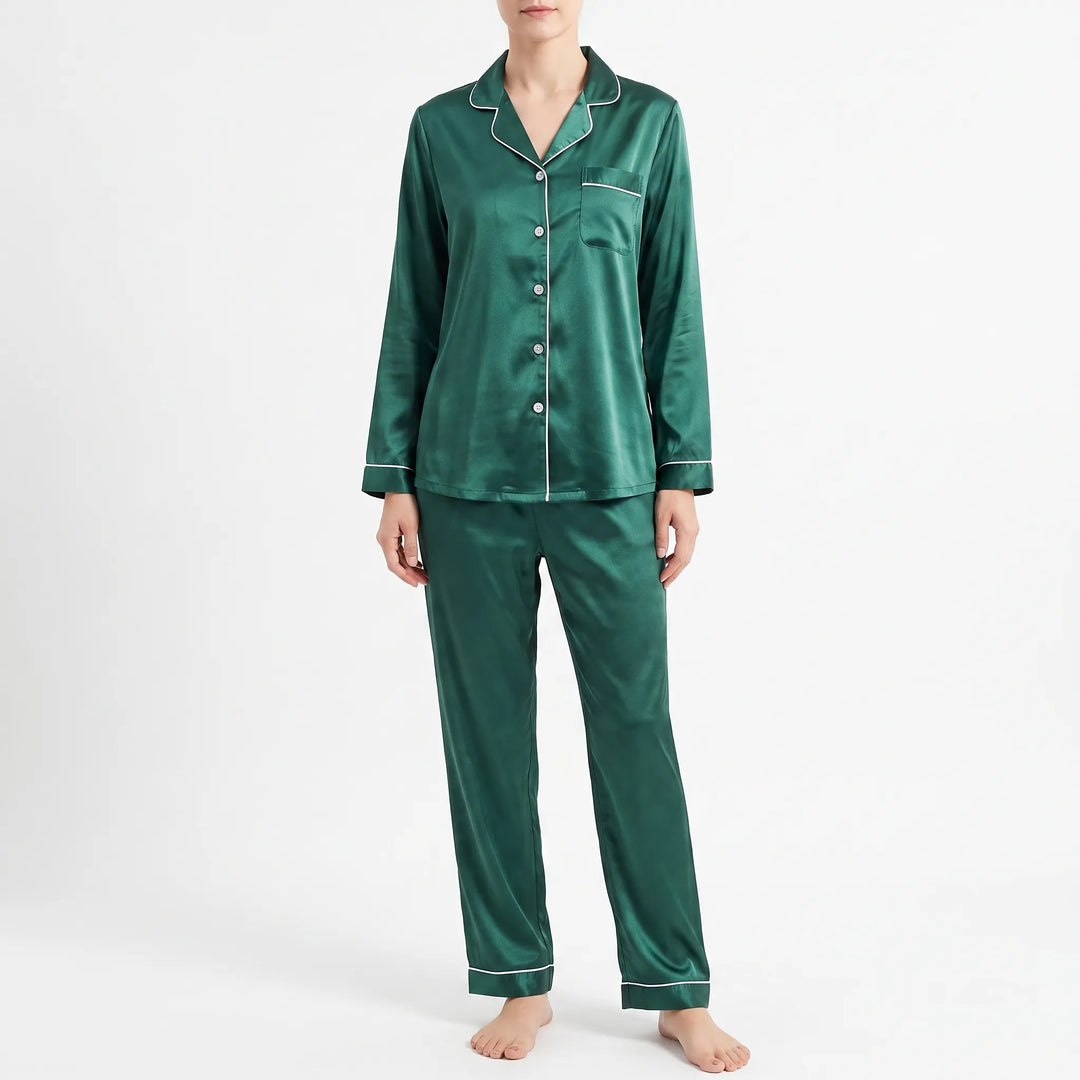 Front view of the green satin pyjama set worn by a model against a plain white background, showing buttons and chest pocket. 2