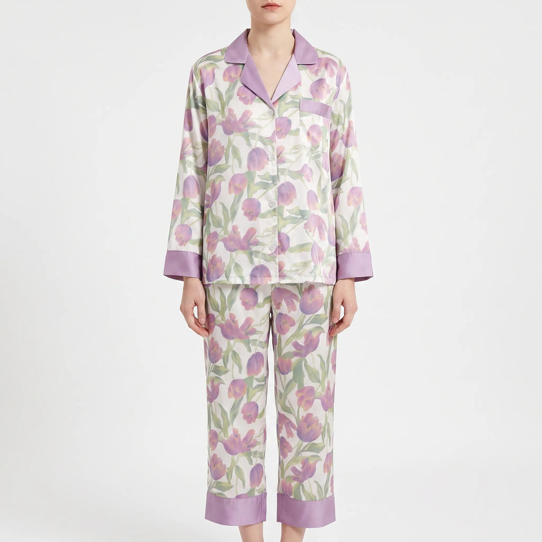 Another colourway for comparison: cream pyjama set with purple tulip print and lilac collar, cuffs and trouser hems, worn by a model. 7