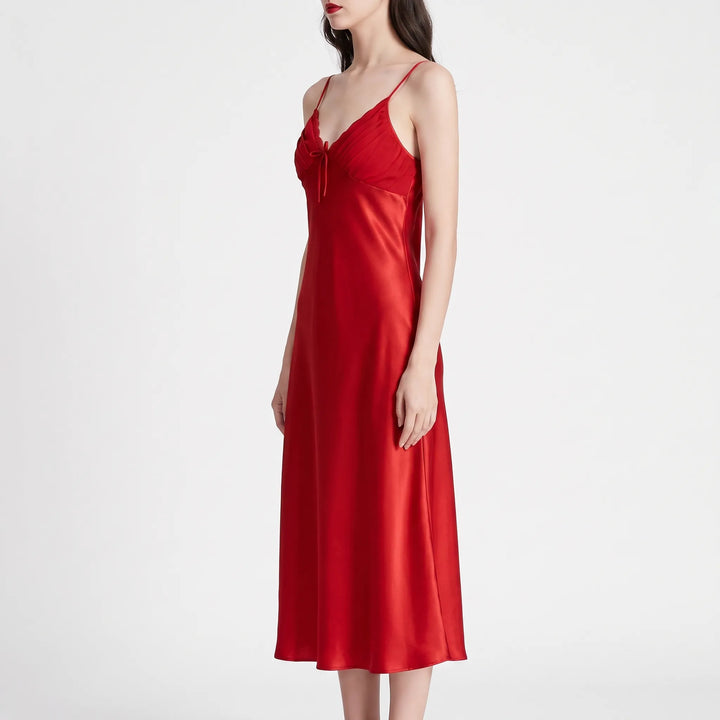 Three-quarter side view of the red satin nightdress on a model, showing the fitted bodice and long straight silhouette. 4