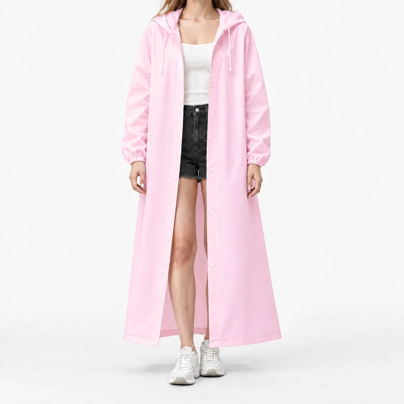Studio front view of the pink hooded raincoat worn open over a white ribbed top and black shorts, with elastic cuffs. 7