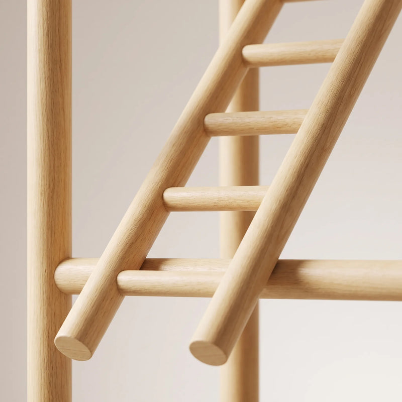 Close-up of a smooth round wooden ladder resting against a horizontal perch bar, showing the fine grain of the light wood. 4