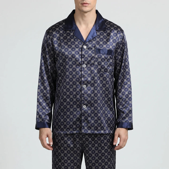 Close front view of the navy satin pyjama shirt with notched collar, chest pocket, light buttons and contrast cuffs. 2
