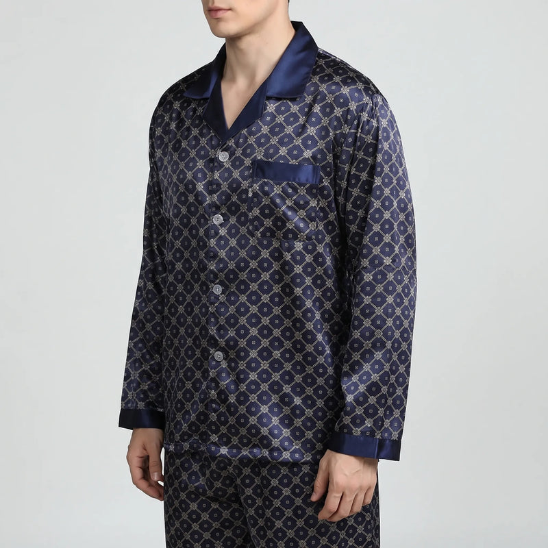 Three-quarter side view of the navy satin pyjama shirt, showing the buttoned front, pocket and contrast-trimmed long sleeve. 4