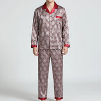 Model wearing a different colourway of the set: a red and grey ornate diamond pattern with red collar, pocket and cuffs. 6