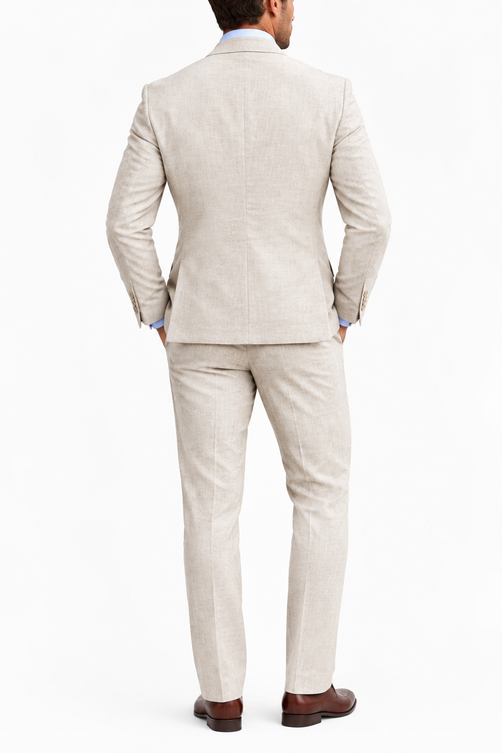 Back view of a full beige suit worn with a light blue shirt and brown leather shoes 7