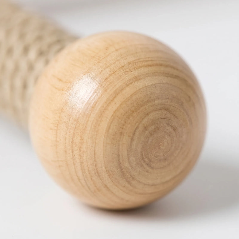 Close-up of a smooth wooden ball at the end of a perch arm, showing the concentric grain rings. 3