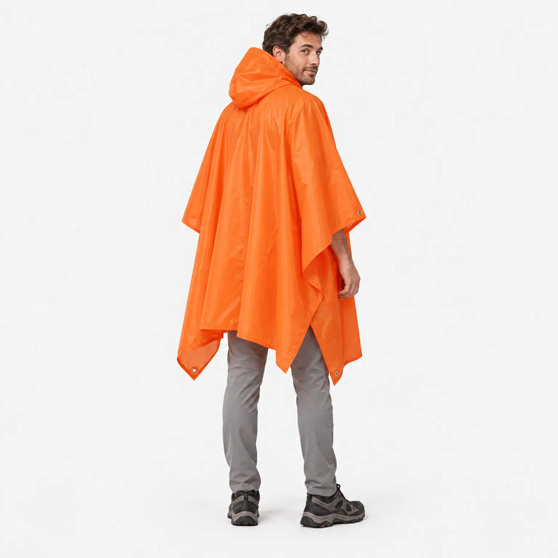 Back view of the orange hooded poncho on a model glancing over his shoulder, showing the draped hood and corner eyelets. 3