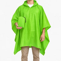 Bright green version of the hooded poncho worn on a model, who holds the matching green drawstring pouch. 7