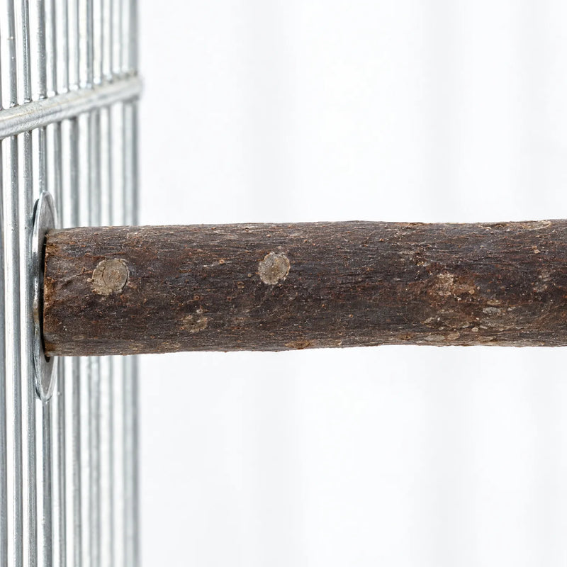 Close-up of a bark-covered wooden perch fixed to a metal cage wire panel with a round washer, showing knots and grain. 3