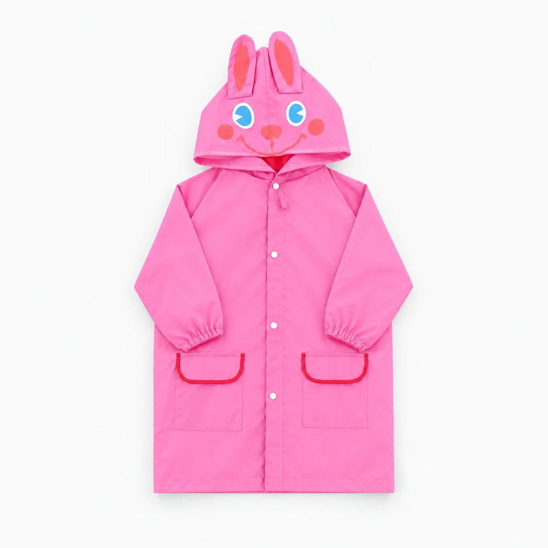 Pink rabbit rain jacket laid flat, with ears and a smiling face on the hood and red-trimmed pockets. 9