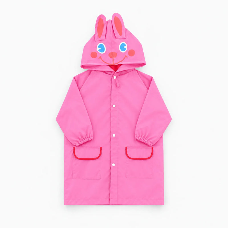 Pink rabbit rain jacket laid flat, with ears and a smiling face on the hood and red-trimmed pockets. 9