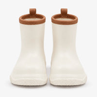 Front view of a pair of cream wellies with brown stitched collars, brown pull loops and a swirl-patterned sole. 10