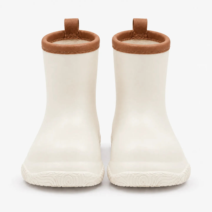 Front view of a pair of cream wellies with brown stitched collars, brown pull loops and a swirl-patterned sole. 10