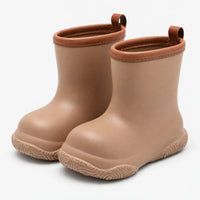 Pair of tan pull-on wellies with brown stitched collars and pull loops, shown at an angle on a plain white background. 2