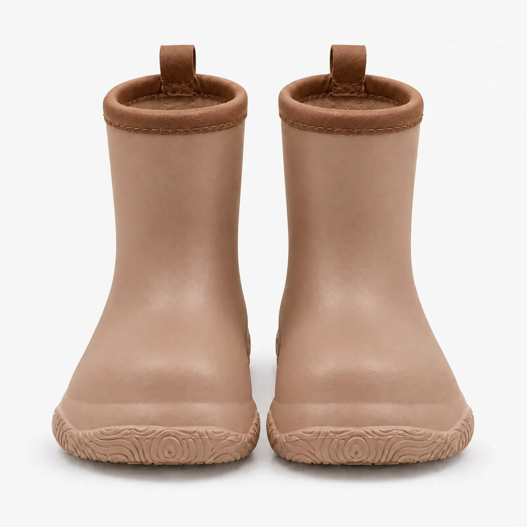 Front view of a pair of tan wellies with brown stitched collars, pull loops and a swirl-patterned sole. 8
