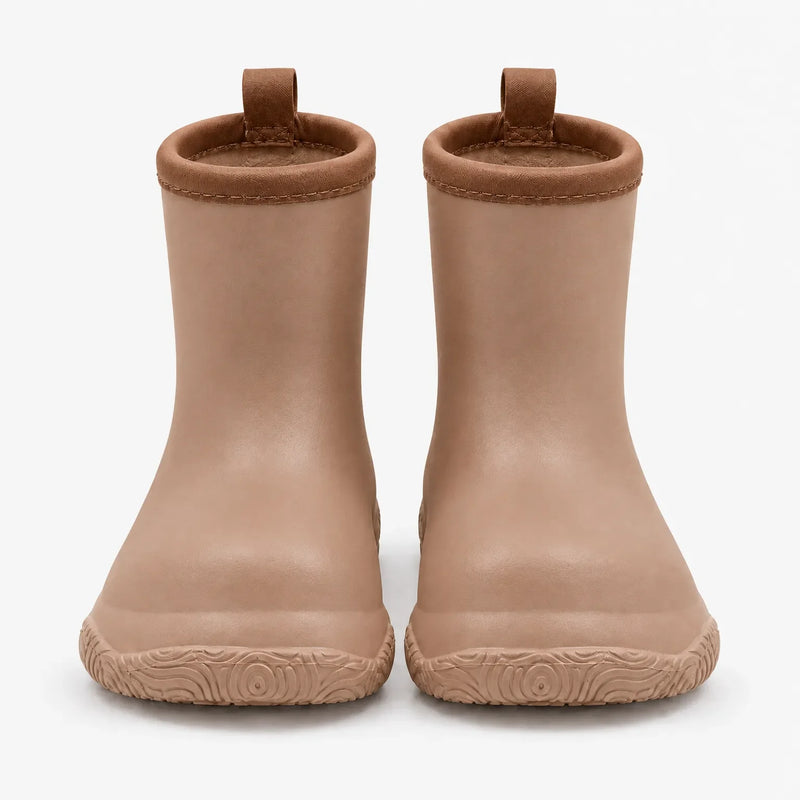 Front view of a pair of tan wellies with brown stitched collars, pull loops and a swirl-patterned sole. 8