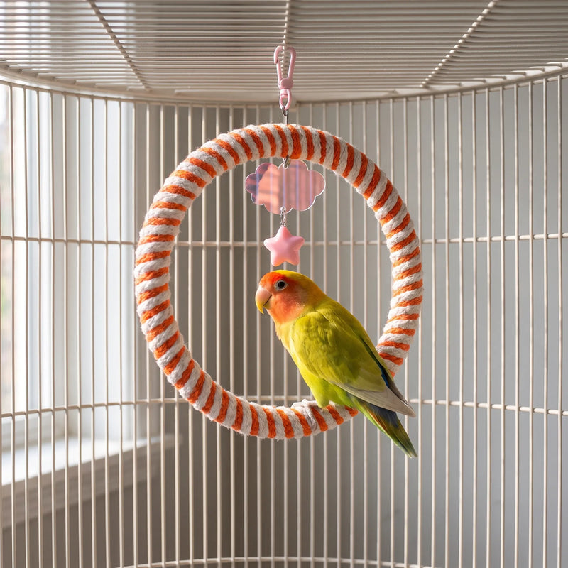 Orange and white rope ring swing hanging inside a cage, with a lovebird perched on the bottom of the ring. 2