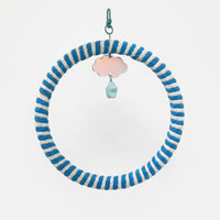 Ring swing wrapped in blue and white rope, hanging from a teal clip with a pearly cloud charm and pale blue bead. 5