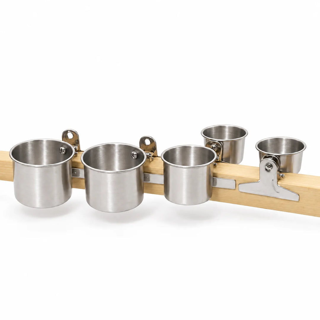 Five stainless steel cups in different sizes, each clipped along a pale wooden perch to show the range. 1