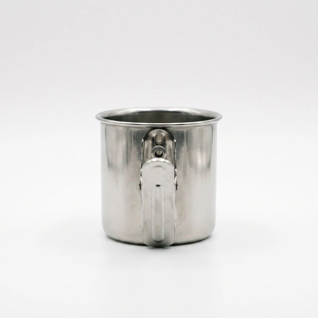 Back view of a steel cup showing the flat spring clip fixed to its side with two rivets. 4