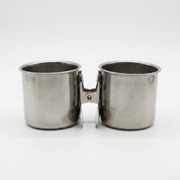 Two steel cups placed side by side on a white background, their clips facing each other in the middle. 5