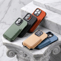 Five phone cases in green, black, orange, tan and blue resting on marble steps 2