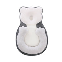Soft positioning pillow for newborns with leg support – CozyNest