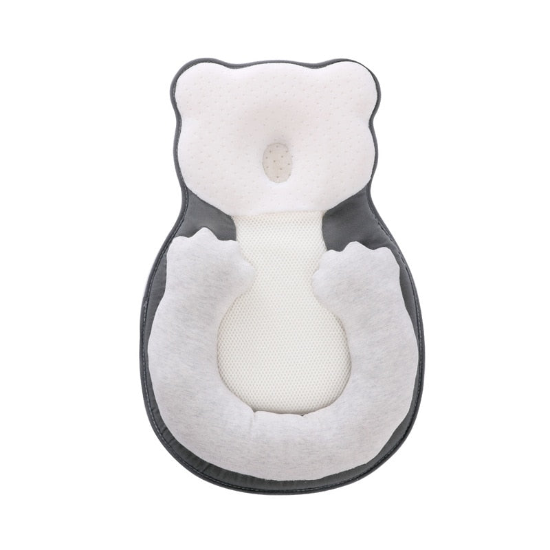 Soft positioning pillow for newborns with leg support – CozyNest