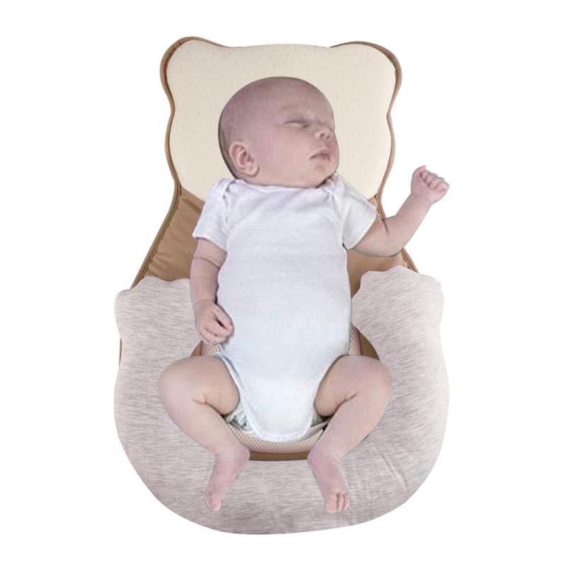 Soft positioning pillow for newborns with leg support – CozyNest