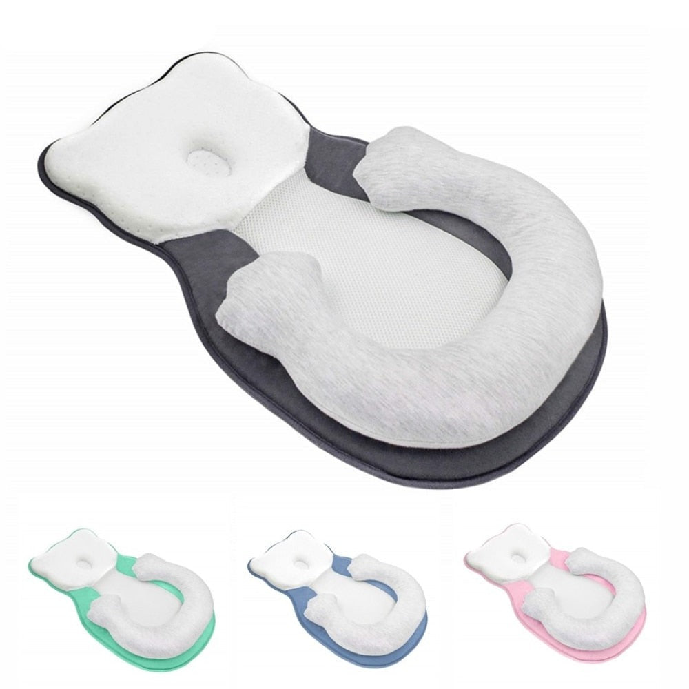 Soft positioning pillow for newborns with leg support – CozyNest