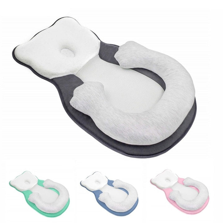 Soft positioning pillow for newborns with leg support – CozyNest
