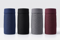 Four rolled-up boxer shorts standing in a row in navy, black, grey and burgundy 3