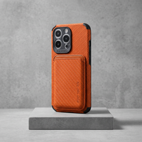 Orange woven-textured phone case with card holder, upright on a grey stone block 6