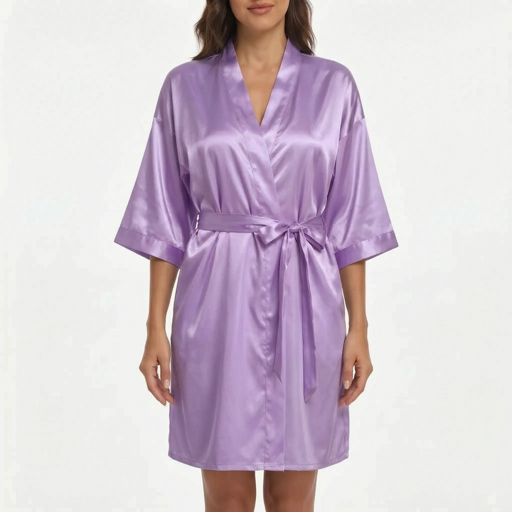 Front view of the short satin robe worn by a model in lilac purple. 9