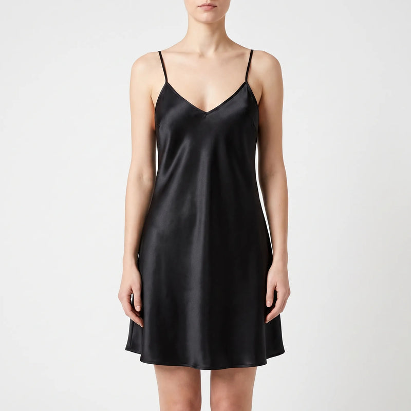 Front view of the same satin slip nightdress in black, worn by a model against a light backdrop. 10