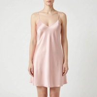 Front view of the same satin slip nightdress in soft pink, worn by a model against a light backdrop. 7
