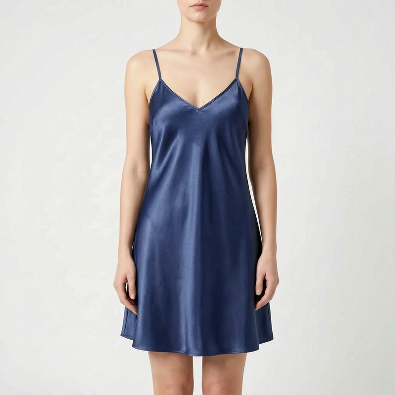 Front view of the same satin slip nightdress in navy blue, worn by a model against a light backdrop. 9
