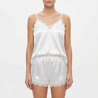 Second front view of the white satin cami and shorts on a model against a plain light background, with lace-edged hems. 6