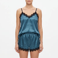 Front view of the set in teal satin with black lace trim on the neckline and shorts hems, worn by a model. 7