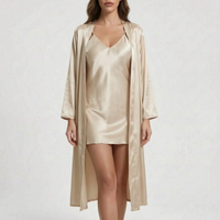 Model wearing the set in a champagne beige satin, slip dress under an open long robe, studio background. 7